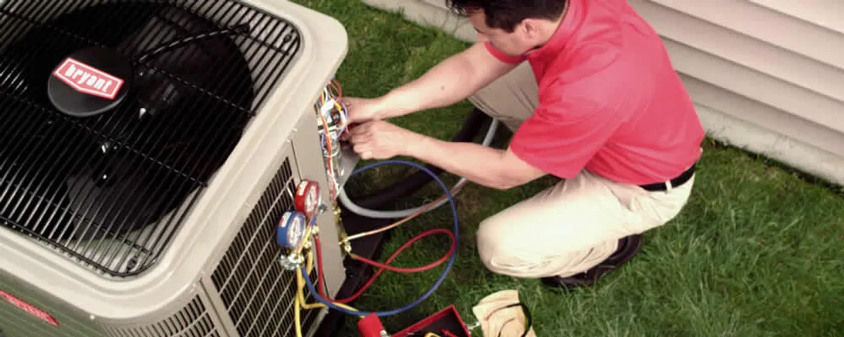 HVAC technician servicing an outdoor air conditioner unit in Allen, TX